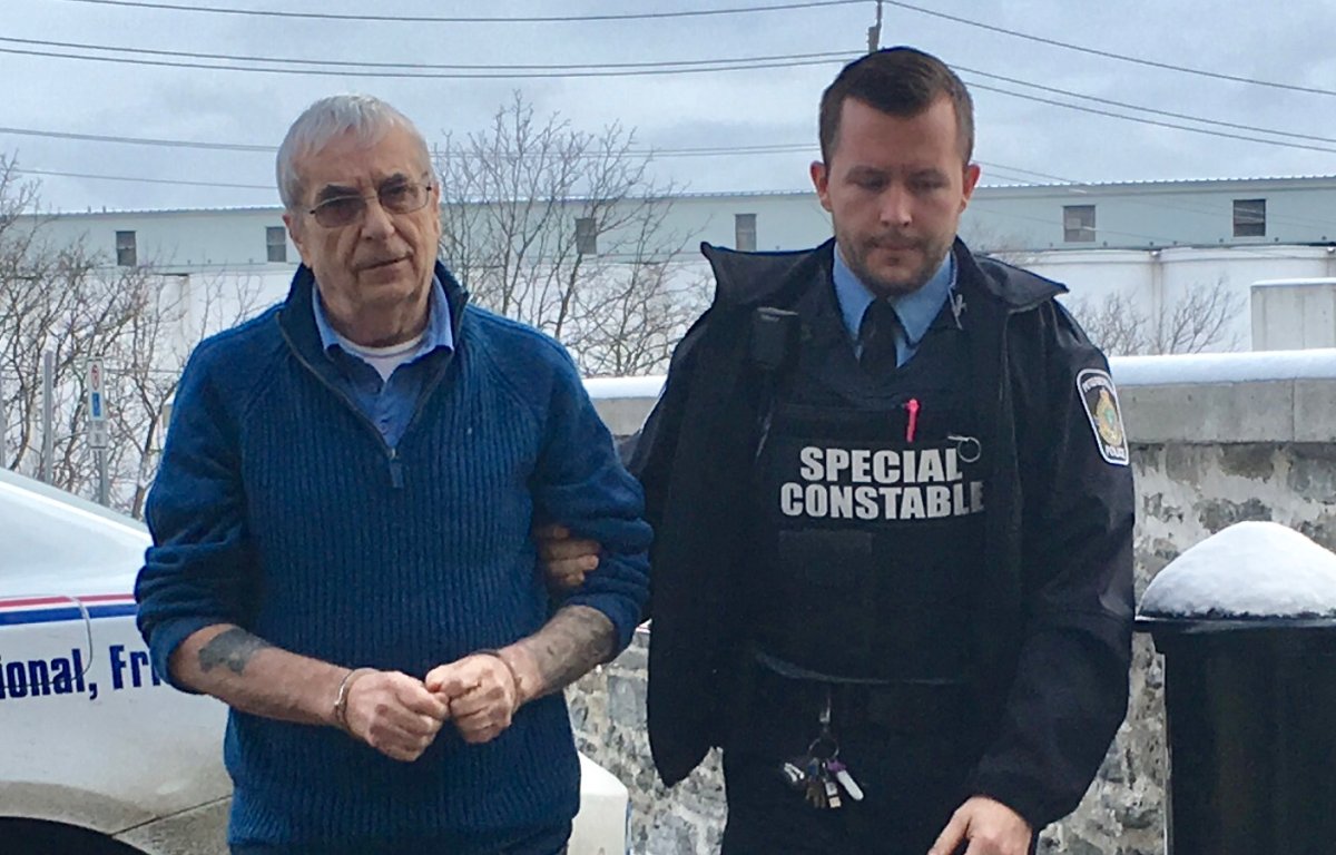Terrance Finn, left, is led to Superior Court in Peterborough on Monday, Jan. 6. Finn is charged with first-degree murder in the shooting death of his wife in August 2018.