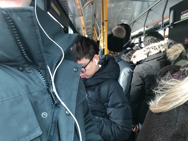 TTC riders packed into shuttle buses following subway service shutdown.