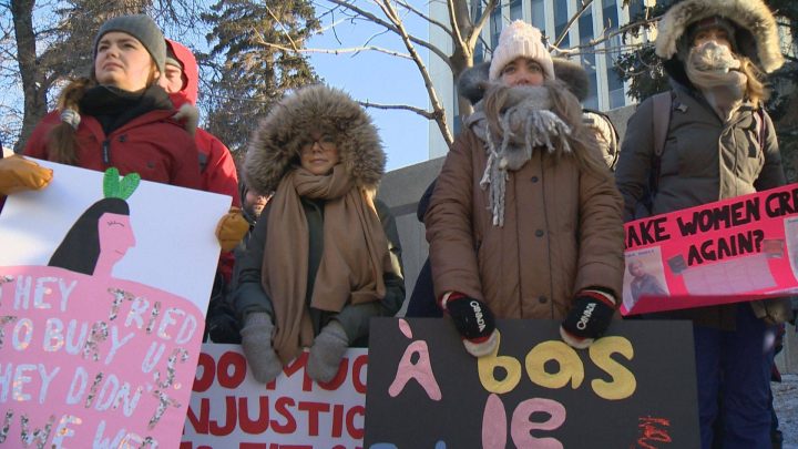 Women marched with homemade signs in downtown Regina on Saturday.