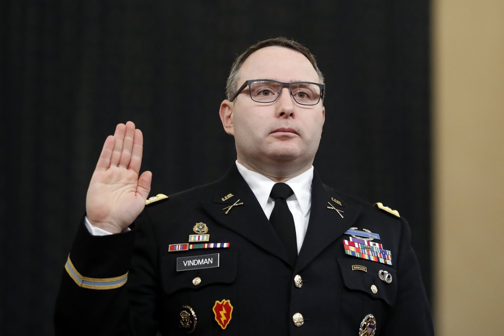 FILE - In this Nov. 19, 2019, file photo National Security Council aide Lt. Col. Alexander Vindman is sworn in to testify before the House Intelligence Committee on Capitol Hill in Washington during a public impeachment hearing of President Donald Trump's efforts to tie U.S. aid for Ukraine to investigations of his political opponents. Vindman was escorted out of the White House complex on Friday, Feb. 7, 2020, according to his lawyer.