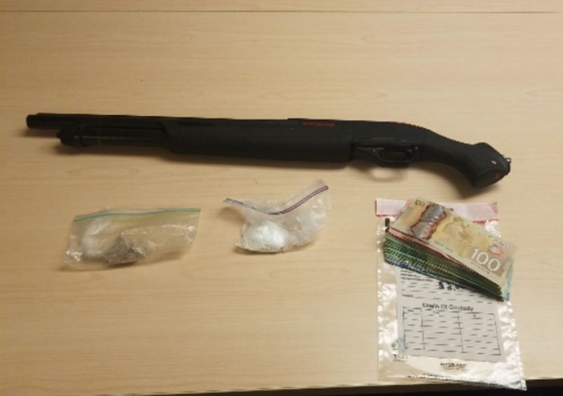 Kingston police say they confiscated a sawed-off shotgun, drugs like fentanyl and cocaine and cash from the north-end home.