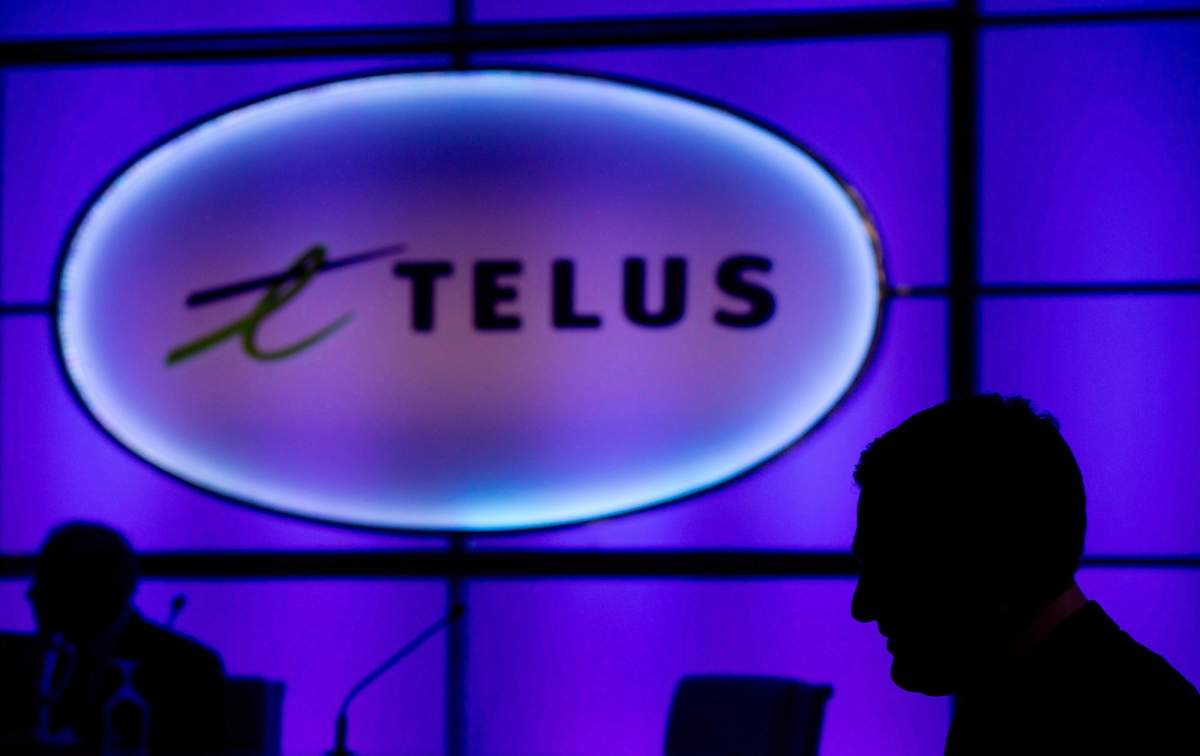 A Telus sign is pictured at company's annual meeting in Vancouver on May 8, 2014. 
