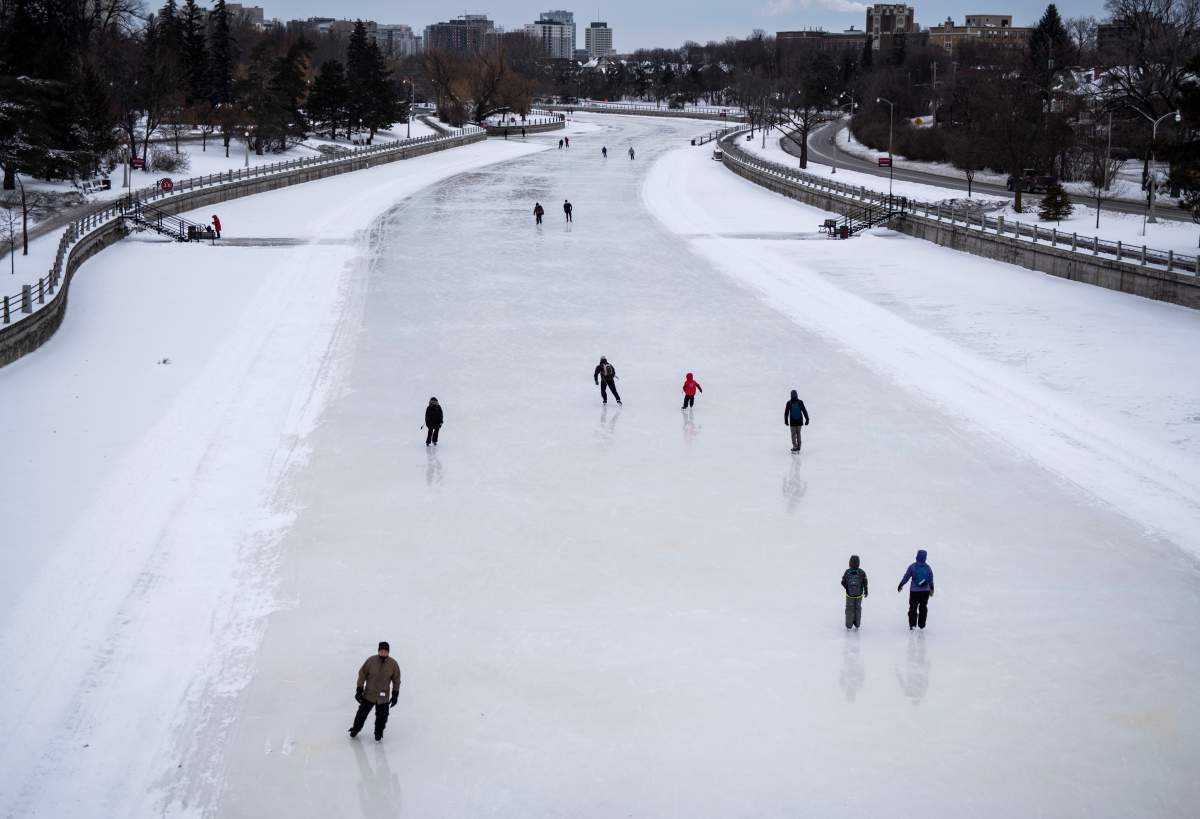Skaters makes their way along the Rideau Canal Skateway in Ottawa on the opening day of its 50th season, on Saturday, Jan. 18, 2020.