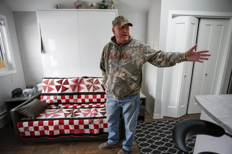 Dirk Lemcke, who served 8 and a half years in a combat regiment with the US military, gestures in the living room of his “tiny home” at the ATCO Village Homes for Heroes in Calgary, Alta., Wednesday, Jan. 29, 2020.