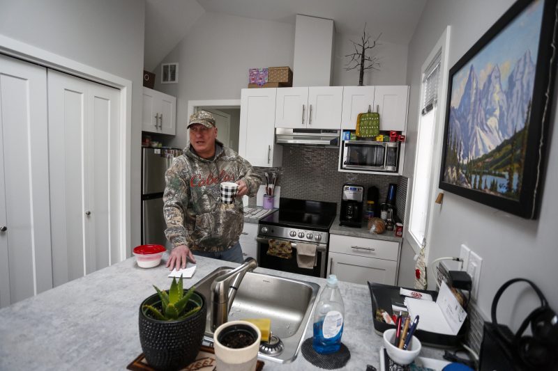 Dirk Lemcke, who served 8 and a half years in a combat regiment with the US military, drinks coffee in the kitchen of his “tiny home” at the ATCO Village Homes for Heroes in Calgary, Alta., Wednesday, Jan. 29, 2020.