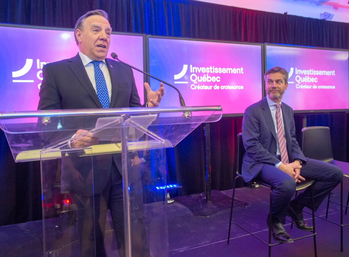 Quebec Premier François Legault makes his remarks as President of Investissement Québec, Guy LeBlanc looks on during a news conference announcing the relaunch of the province's investment arm on Monday, February 3, 2020 in Montreal.