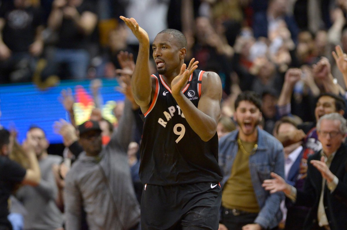 Toronto Raptors centre Serge Ibaka (9) and fans react after Ibaka make the winning basket during second half NBA action against the Indiana Pacers in Toronto on Wednesday, Feb. 5, 2020. 