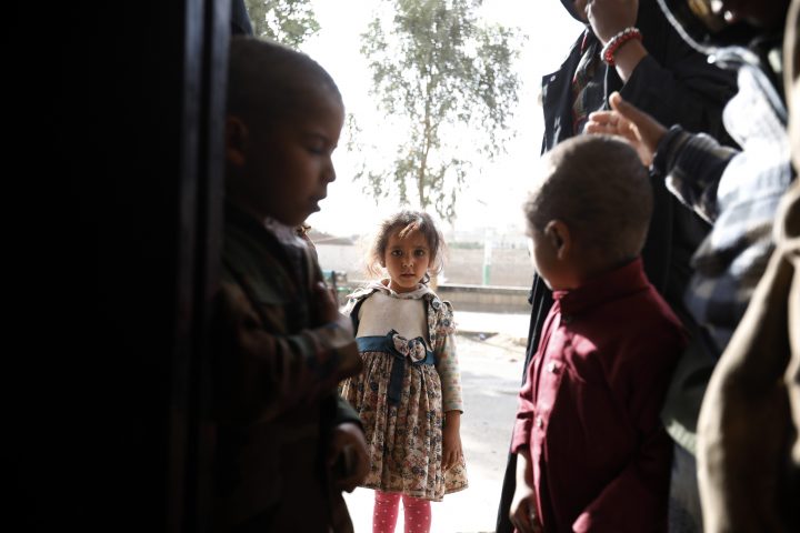 Displaced Yemeni children stand outside a temporary shelter in Sanaa, Yemen, Feb. 9, 2020.