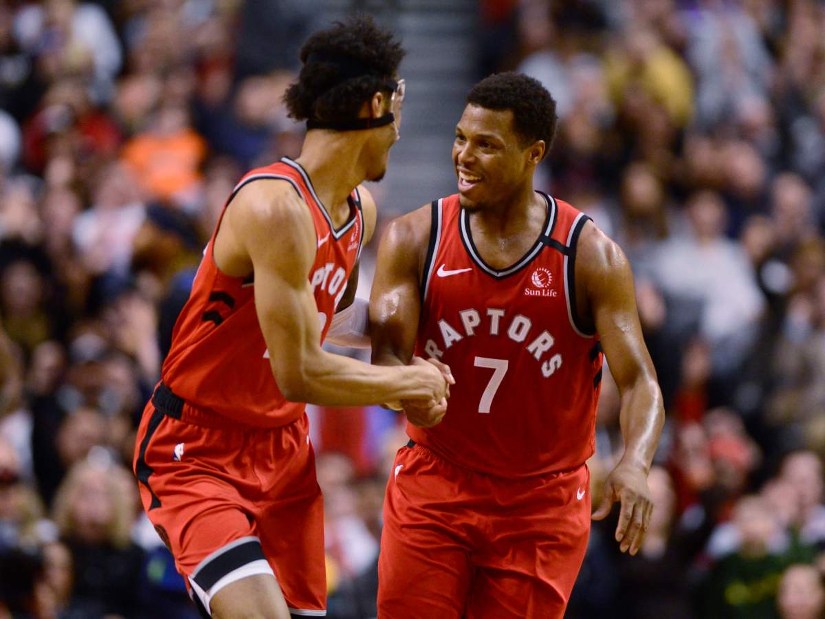 Toronto Raptors guard Kyle Lowry (7) celebartes his three-pointer with teammate Patrick McCaw (22) during second half NBA basketball action in Toronto, Monday, Feb. 10, 2020. 