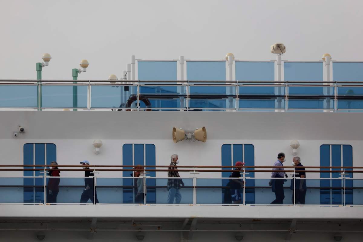 A group of quarantined passengers exercise on the Diamond Princess cruise ship Feb. 15, 2020, in Yokohama, near Tokyo.