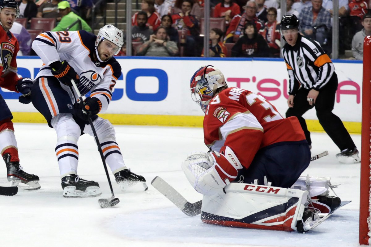 Edmonton Oilers center Leon Draisaitl (29) shoots on goal as Florida Panthers goaltender Sam Montembeault defends during the second period of an NHL hockey game, Saturday, Feb. 15, 2020, in Sunrise, Fla. (AP Photo/Lynne Sladky).
