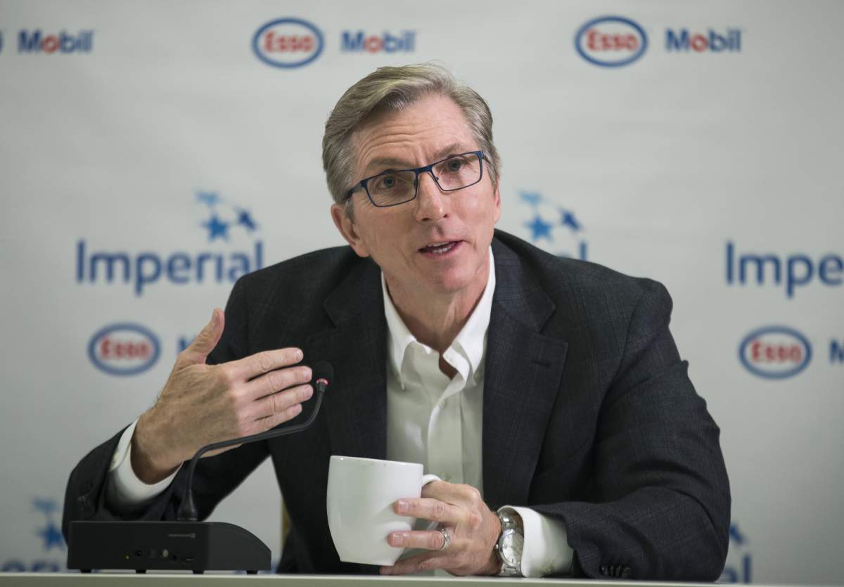 Former Imperial Oil outgoing President and CEO Rich Kruger answers questions during a news conference in Calgary, Wednesday, Dec. 4, 2019.