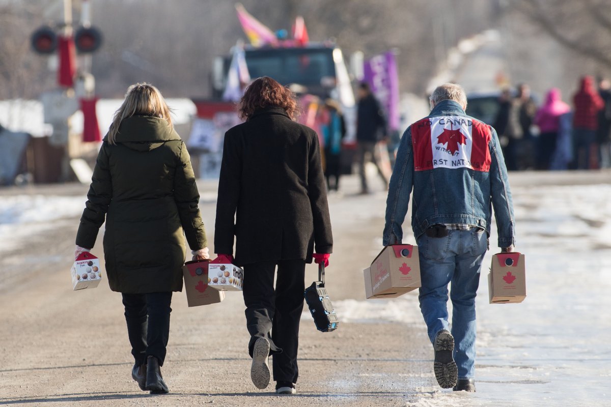 Supporters bring supplies to protesters during a rail blockade in Tyendinaga Mohawk Territory, Ont. on Monday, Feb.17, 2020, in solidarity with the Wet'suwet'en hereditary chiefs opposed to the LNG pipeline in northern British Columbia. 