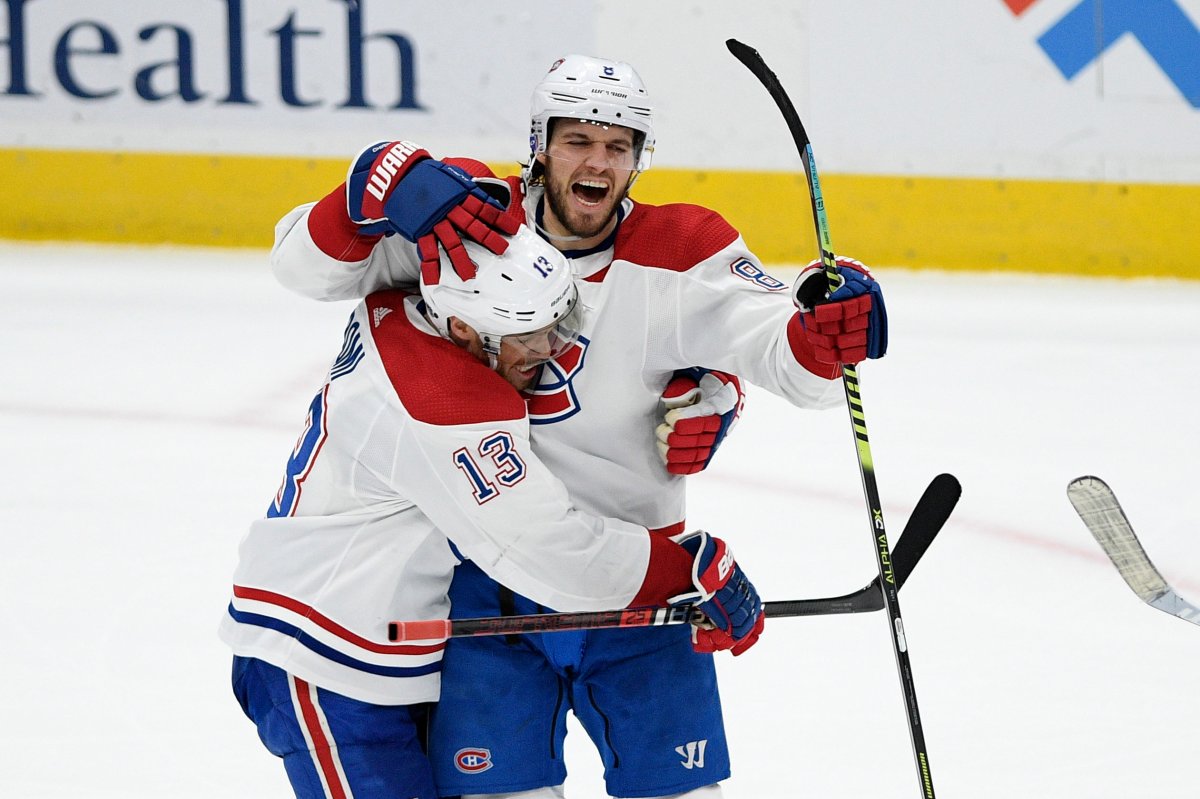 Montreal Canadiens defenseman Ben Chiarot (8) celebrates his game-winning goal with center Max Domi (13) in overtime of an NHL hockey game against the Washington Capitals, Thursday, Feb. 20, 2020, in Washington. The Canadiens won 4-3 in overtime.