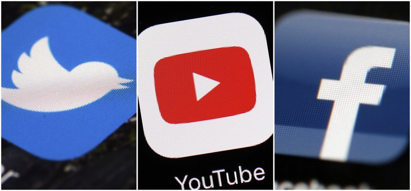 FILE - This combination of images shows logos for companies from left, Twitter, YouTube and Facebook. The British government announced Wednesday Feb. 12, 2020, it will give regulators the power to fine social media companies for harmful material on their platforms. 