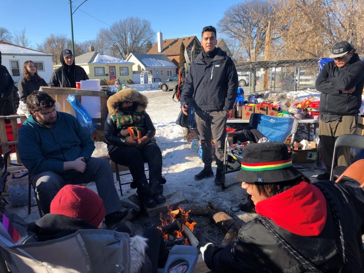 Andre Bear, a law student, speaking to the other demonstrators assembled at the camp.