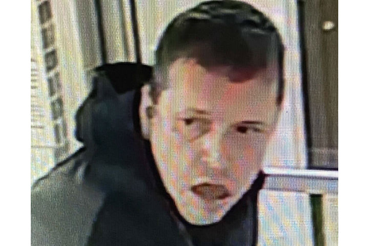 The suspect is described as a man with short brown hair who was wearing dark pants or jeans, brown boots and a grey-and-black jacket and carrying a light blue bag containing tools he allegedly used to enter the building.