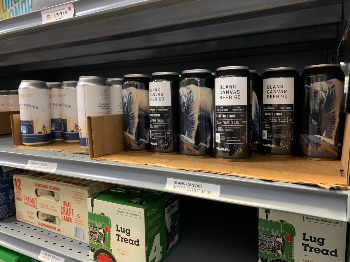 Cans of Blank Canvas Beer Co's Arctic Stout on a store shelf.