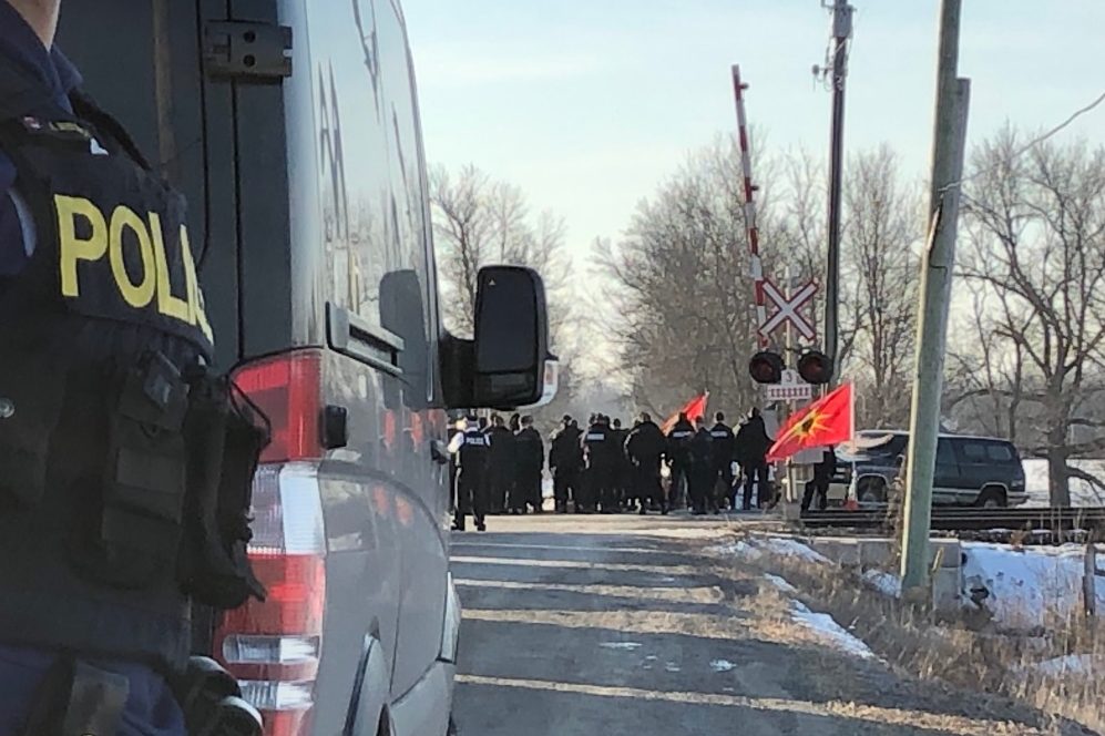 Ontario Provincial Police move in on protesters in Belleville, Ont. on February 24, 2020.