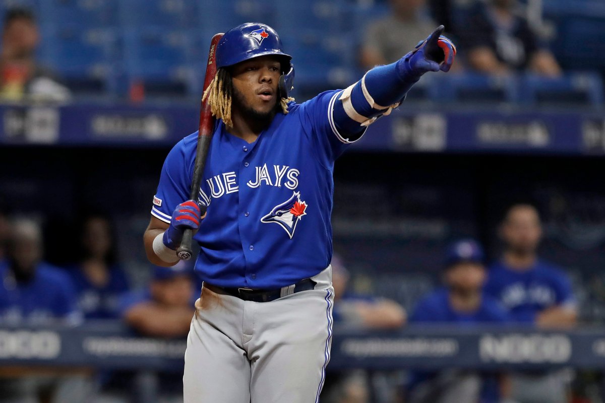 Toronto Blue Jays' Vladimir Guerrero Jr. points at first base umpire Ben May after being called out on strikes during the fourth inning of a baseball game against the Tampa Bay Rays, Friday, Sept. 6, 2019, in St. Petersburg, Fla.