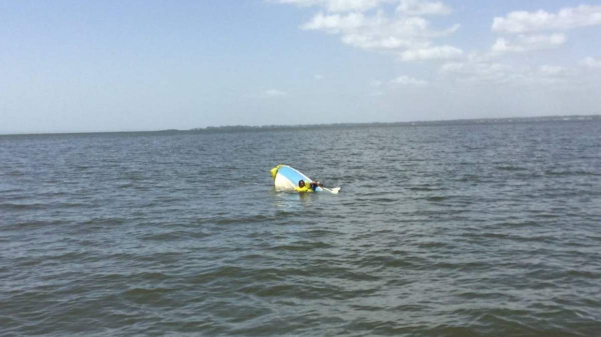 A 63-year-old man was found floating at an Australian bay after his boat capsized.