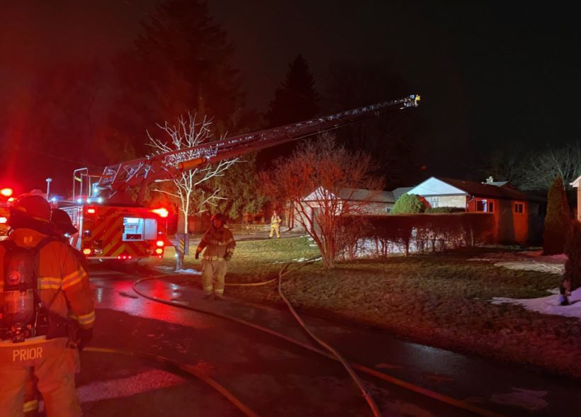 Fire crews dousing a blaze at a residence on Carol Street.