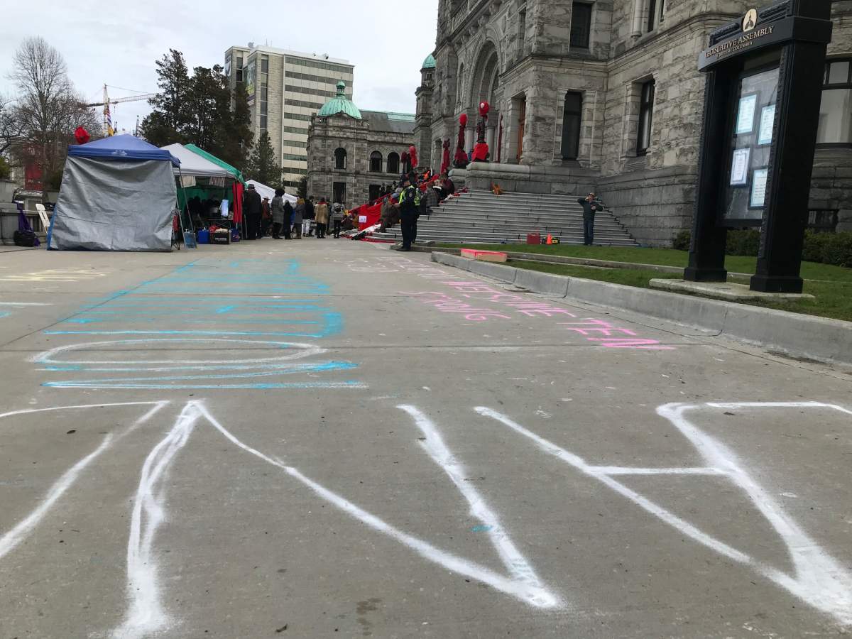 Chalk is sprayed on the walkways at the B.C. Legislature. 