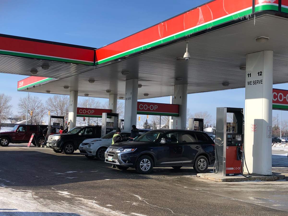 Customers are seen filling up at the Co-op gas station at 1745 Kenaston Blvd., in Winnipeg early Sunday afternoon.