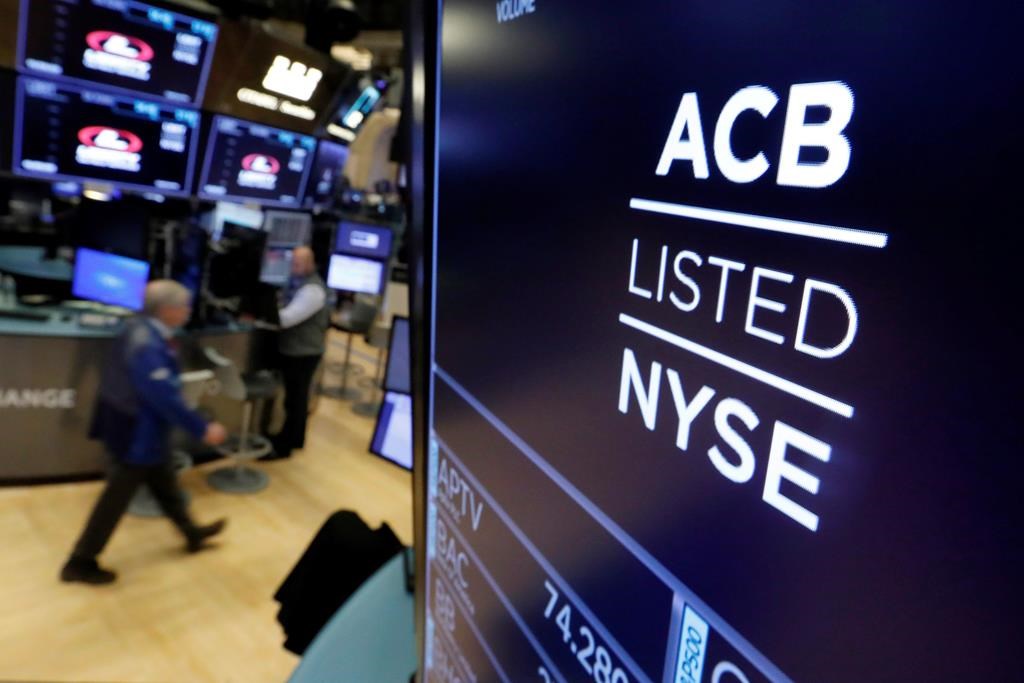 The symbol for Aurora Cannabis appears above a trading post on the floor of the New York Stock Exchange as the Canadian company lists on October 23, 2018.