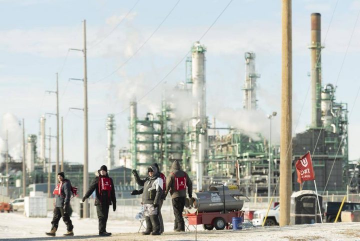 Unifor 594 members walk the picket line at the Co-op Refinery in Regina on Tuesday January 21, 2020. Regina police have arrested four more people involved in a labour dispute at the Co-op oil refinery. THE CANADIAN PRESS/Michael Bell.