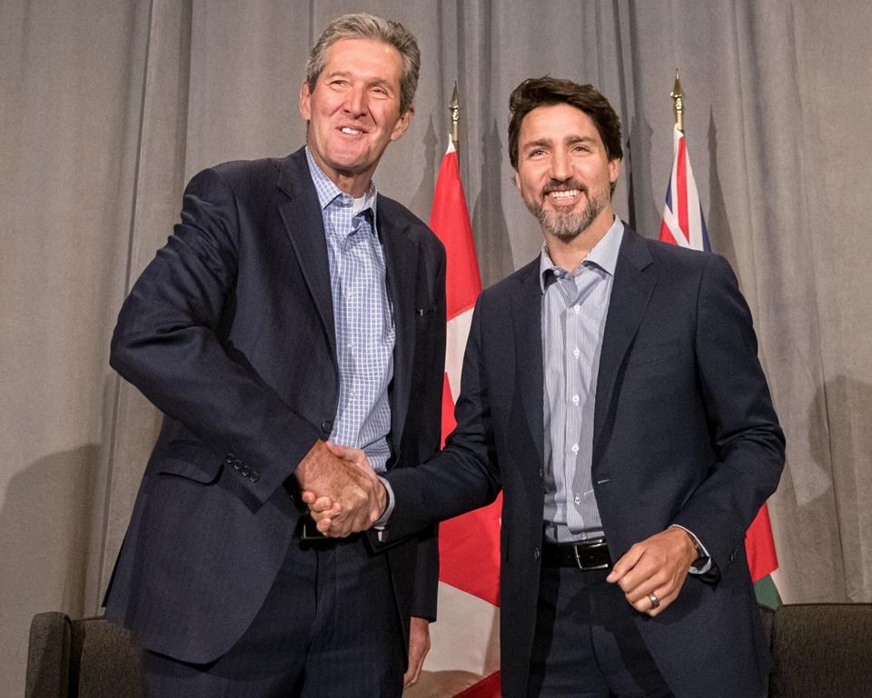 Manitoba Premier Brian Pallister says he feels the federal government is willing to negotiate a deal on a carbon tax. Pallister shakes hands with Prime Minister Justin Trudeau Monday, Jan. 20, 2020.