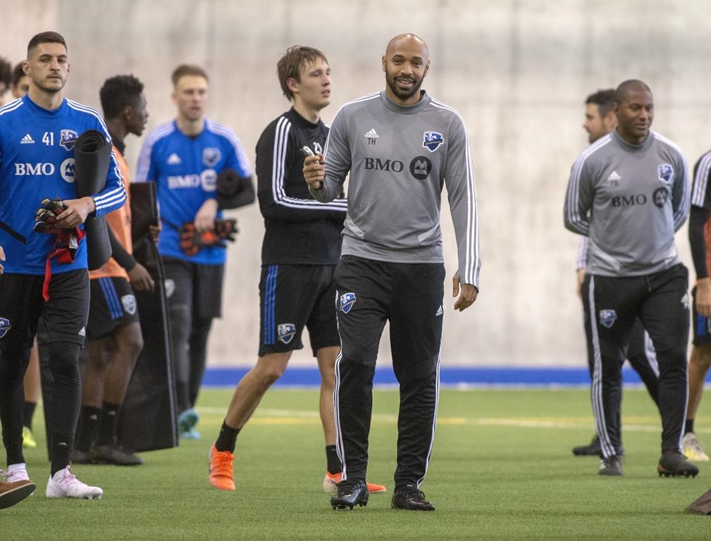 Montreal Impact head coach Thierry Henry, centre, conducts his first practice Tuesday, January 14, 2020 in Montreal. THE CANADIAN PRESS/Ryan Remiorz.