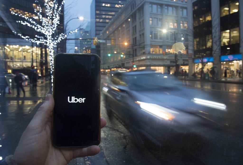 The Uber app is pictured on a smartphone in downtown Vancouver, B.C., Monday, Dec. 30, 2019. 