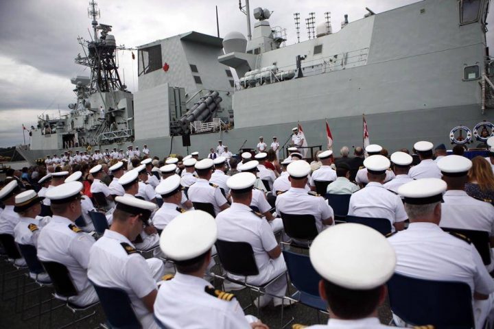 The HMCS Calgary is seen behind sailors during a change of command ceremony at CFB Esquimalt, in Esquimalt, B.C., Wednesday, June 24, 2015. The Royal Canadian Navy and Canadian Coast Guard say they hundreds more sailors as recruitment has failed to keep pace with attrition.THE CANADIAN PRESS/Chad Hipolito.