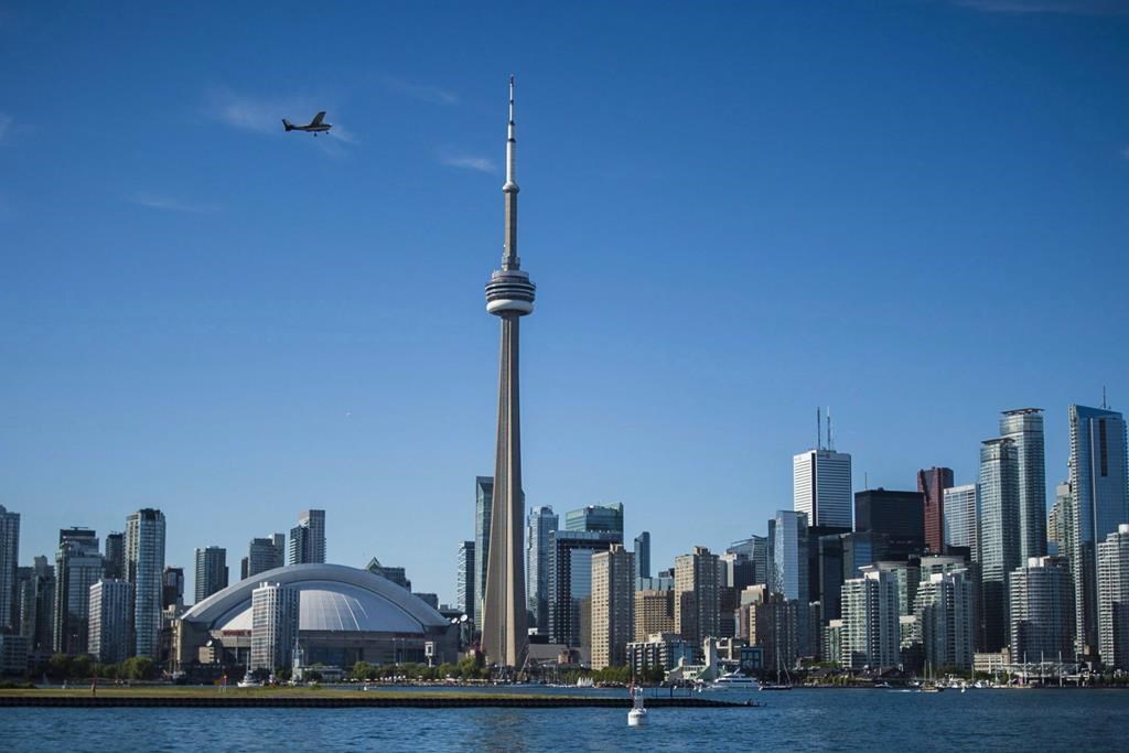 The Toronto skyline is photographed from the Hanlan's Point Ferry as it travels back to the city on Thursday, June 21, 2018. THE CANADIAN PRESS/Tijana Martin.