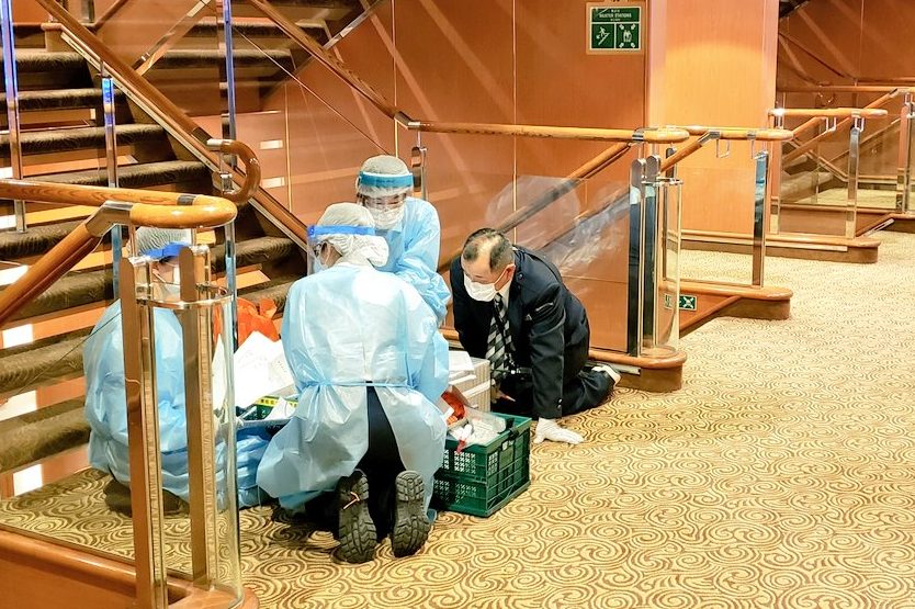 Health officials test passengers for the novel coronavirus aboard the Diamond Princess in Yokohama, Japan on Feb. 4, 2020.