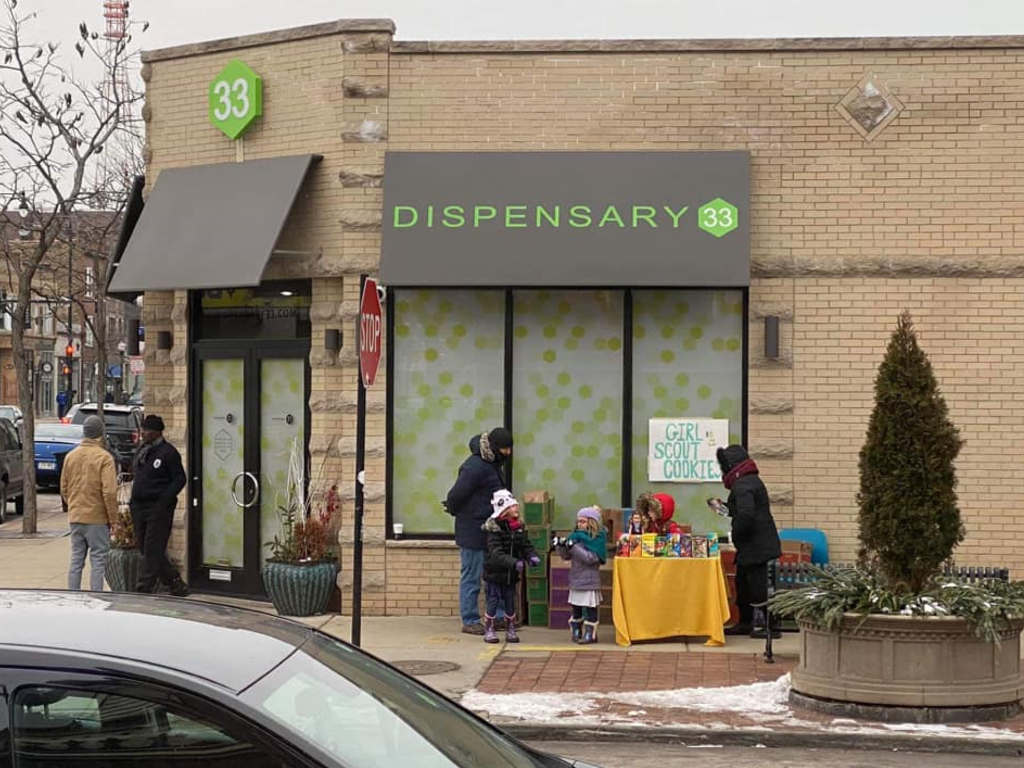 A troop of Girl Scouts set up their cookie stand outside of Chicago marijuana shop, Dispensary 33.