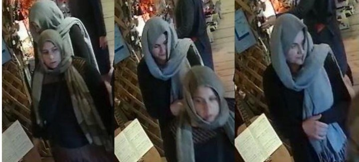 One woman engaged with an employee, while a second entered the back office and two others acted as lookouts, police say.