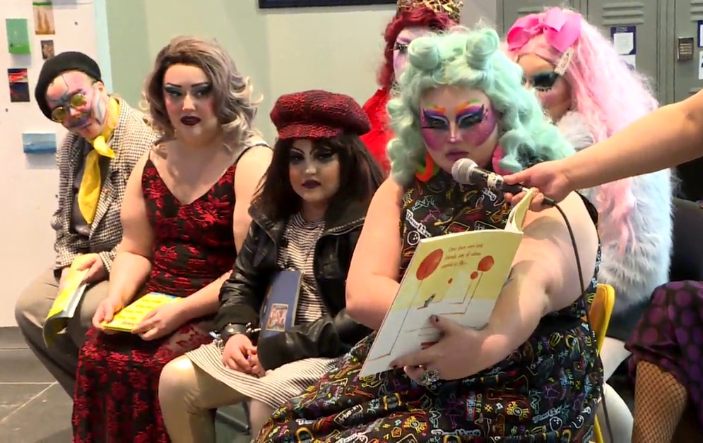 Five drag queens and two drag kings read storybooks at Millennium Library to protest security measures at the library Sunday.