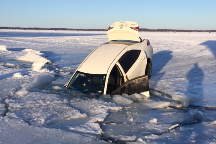 Officers say the driver and passenger were ice-fishing and left their Toyota parked on the ice.