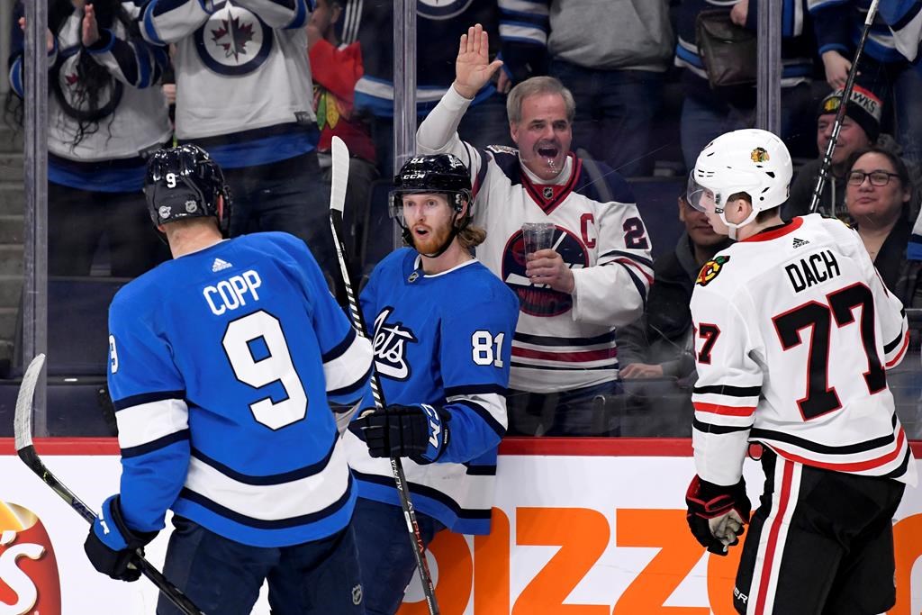 The Winnipeg Jets' Kyle Connor (81) celebrates his short-handed goal against the Chicago Blackhawks with Andrew Copp (9) during second-period NHL action in Winnipeg on Sunday, Feb. 9, 2020.