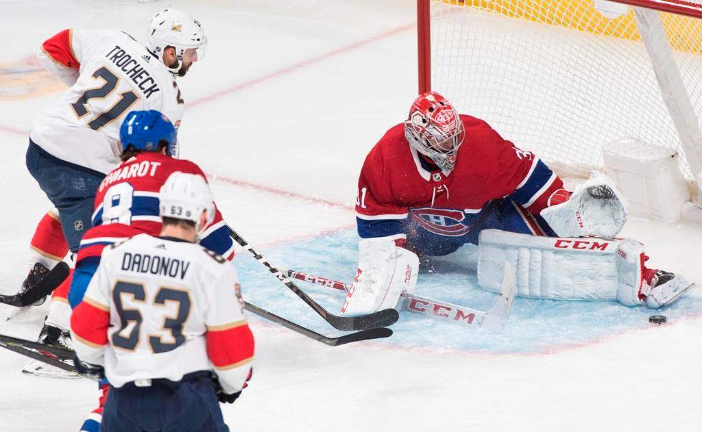 Montreal Canadiens goaltender Carey Price makes a save against Florida Panthers' Vincent Trocheck (21) during second period NHL action in Montreal, Saturday, Feb. 1, 2020.