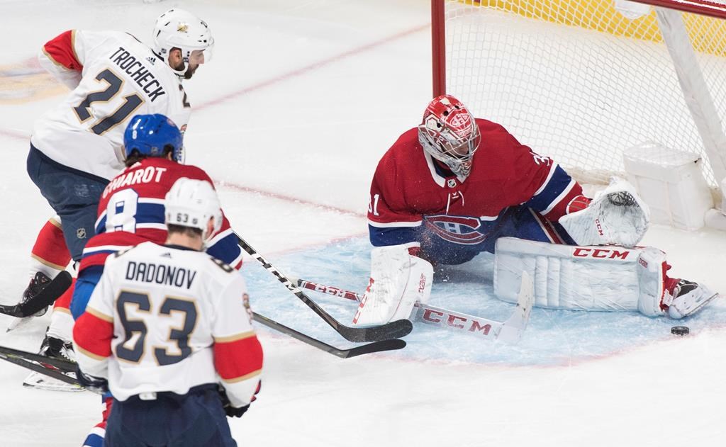 Montreal Canadiens goaltender Carey Price makes a save against Florida Panthers' Vincent Trocheck (21) during second period NHL action in Montreal, Saturday, Feb. 1, 2020.