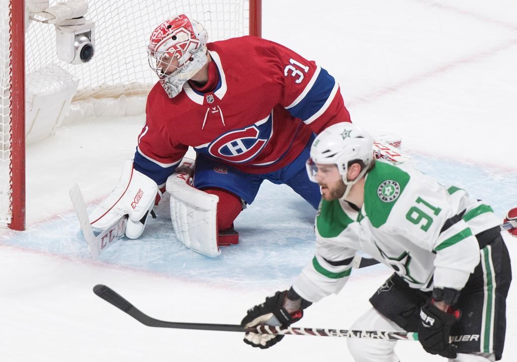 Montreal Canadiens goaltender Carey Price is scored on by Dallas Stars' Tyler Seguin (91) during overtime NHL action in Montreal, Saturday, Feb. 15, 2020.