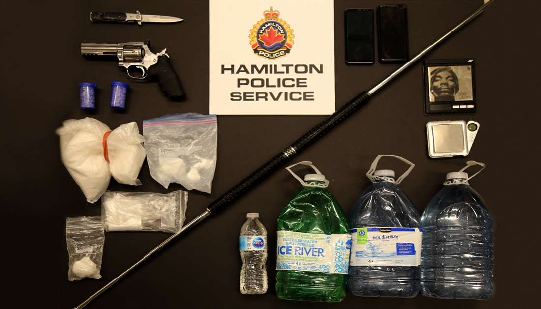 Hamilton Police say they seized weapons, cash and about $100,000 in cocaine and other drugs from a Grimsby home on Feb 12, 2020.