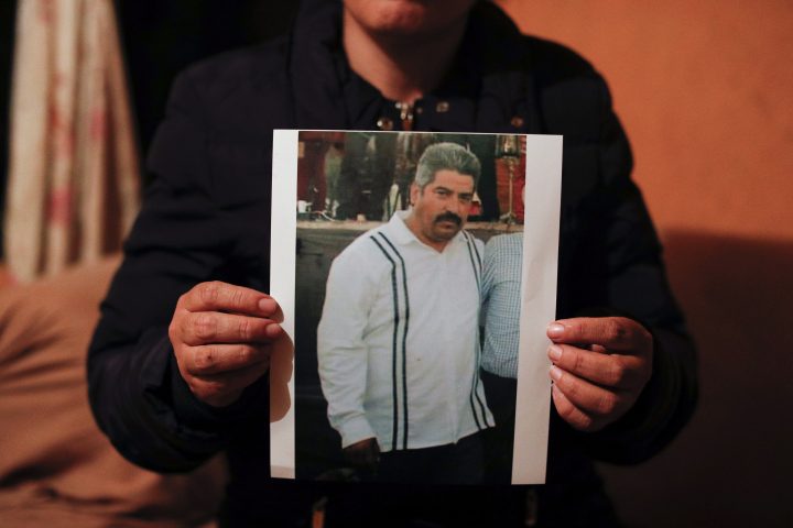 Rebeca Valencia Gonzalez holds up a picture of her husband, environmental activist Homero Gomez Gonzalez, in their home in Ocampo, Michoacan state, Mexico, Thursday, Jan. 30, 2020.