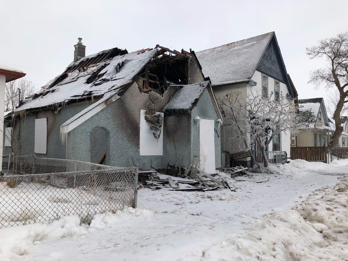 A gaping hole was left in the roof of a Weston home after a house fire. Michael Draven/Global News.