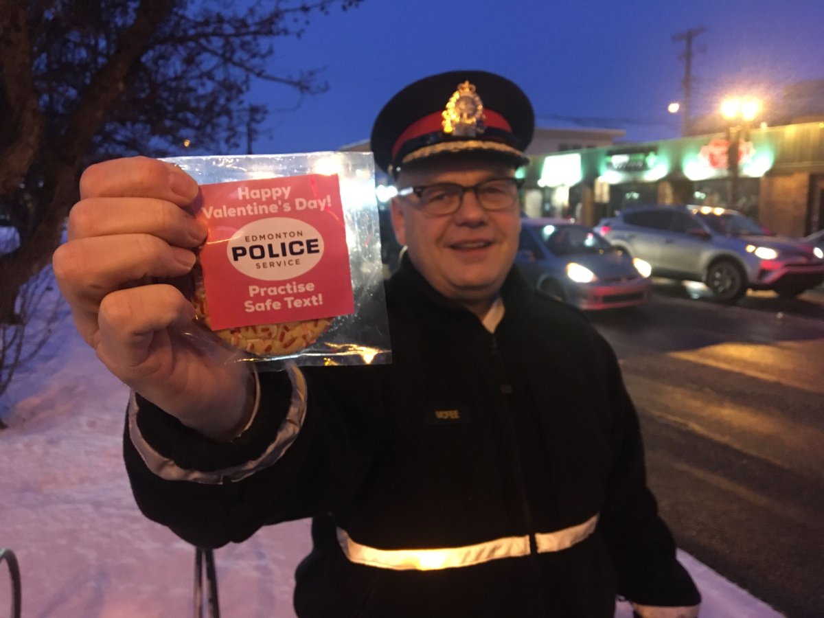 Edmonton police members, including Chief Dale McFee, were handing out Valentine's Day cookies reminding people not to engage in distracted driving on on Friday, Feb. 14, 2020. 
