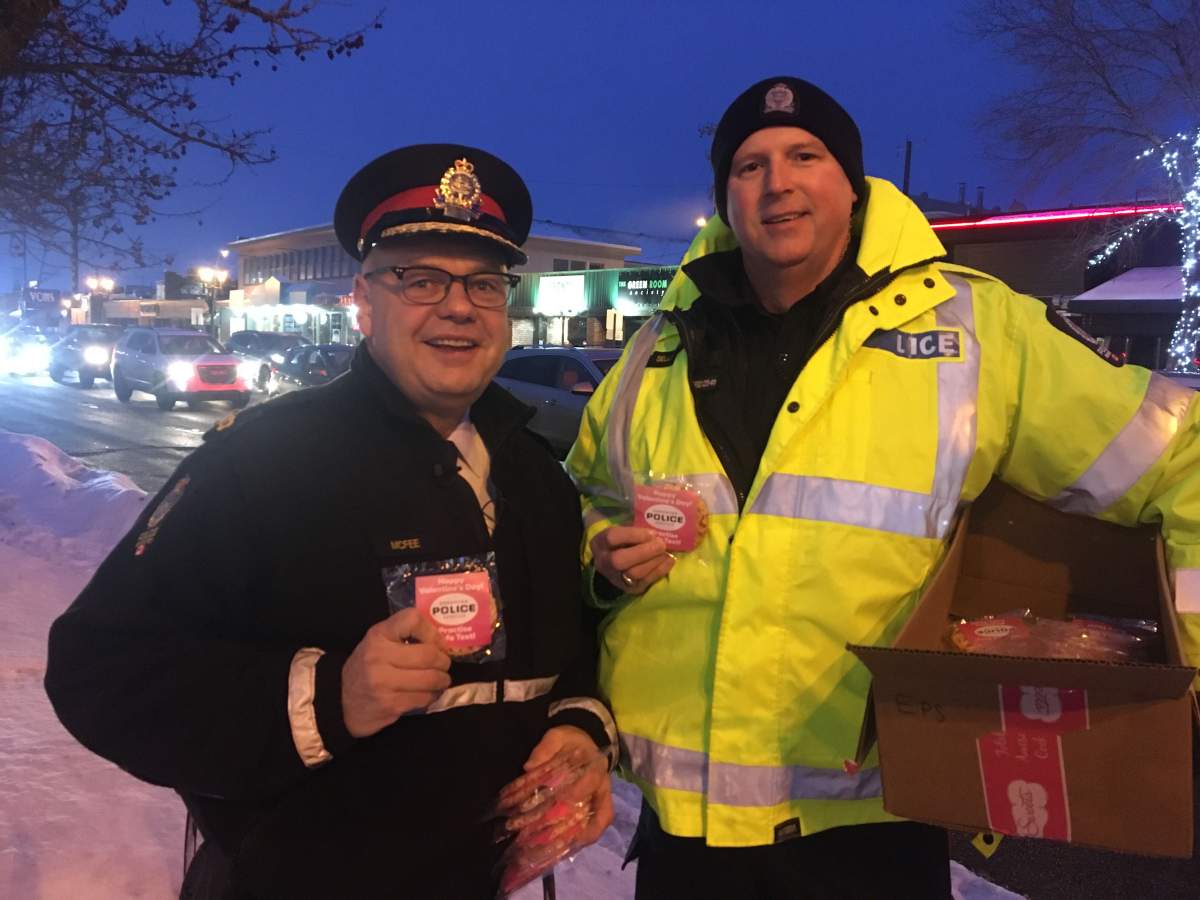 Edmonton police members, including Chief Dale McFee, were handing out Valentine’s Day cookies reminding people not to engage in distracted driving on on Friday, Feb. 14, 2020.