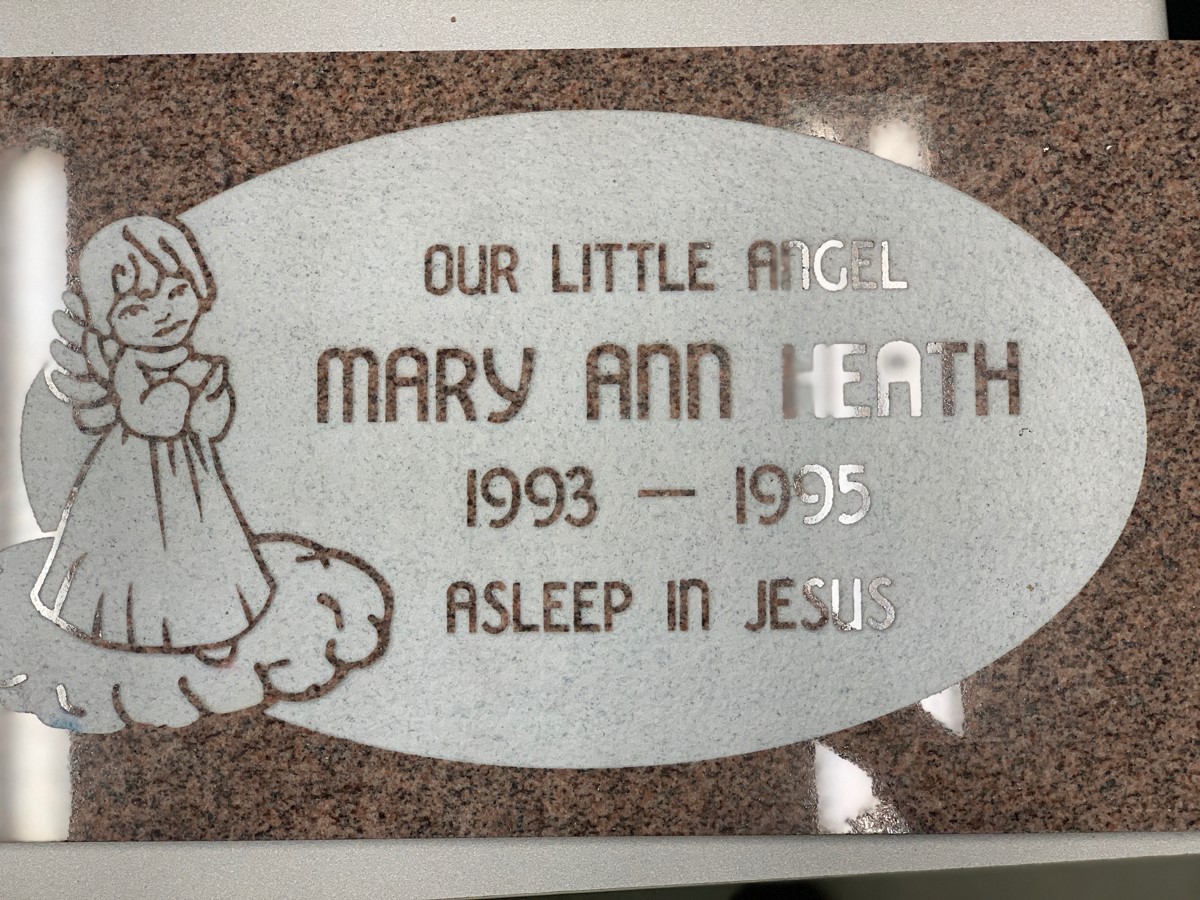 Police are searching for the family associated with a child's headstone, recovered by RCMP. 